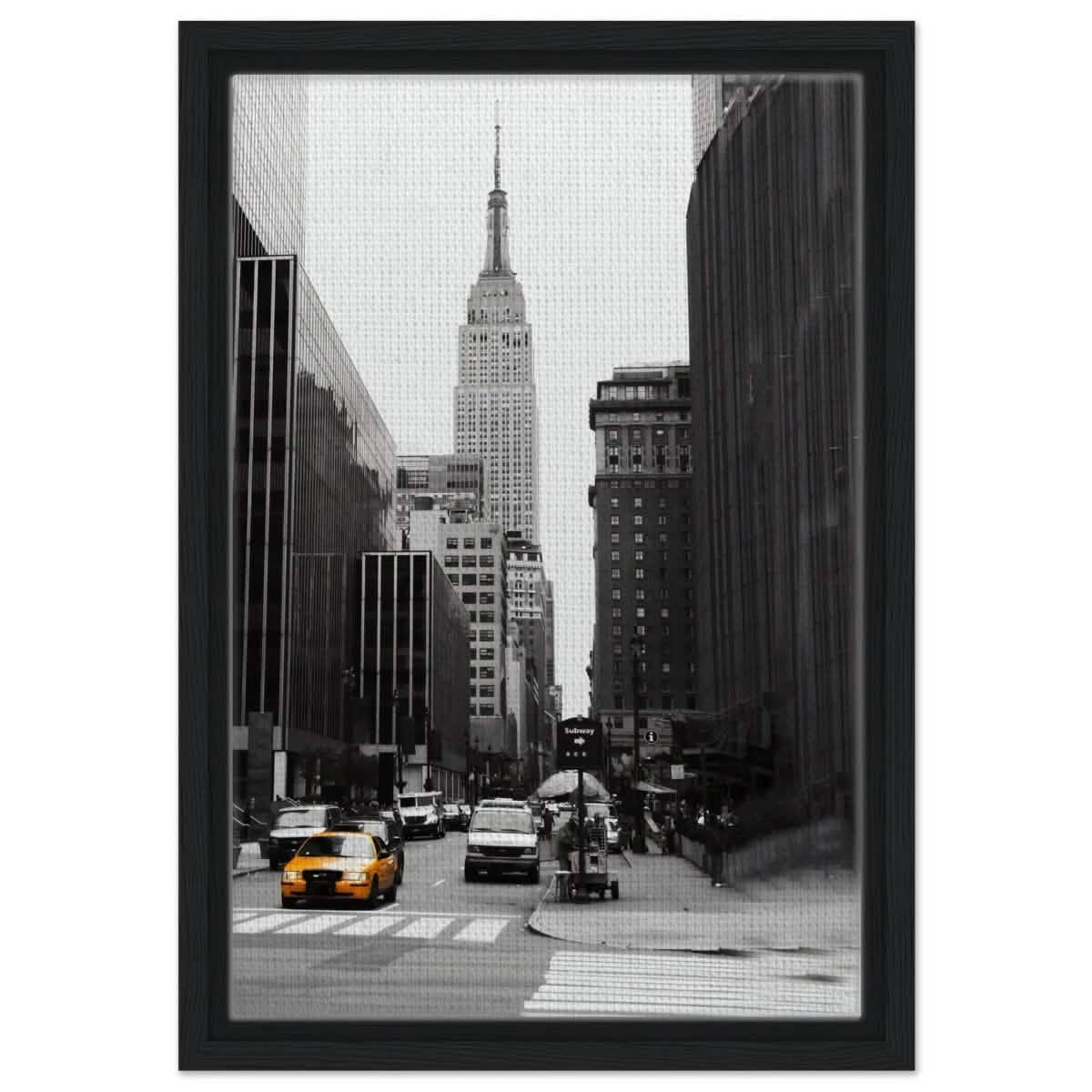 Manhattan Moments - Empire State Tower and Yellow Cab - Framed Canvas - 30x45 cm / 12x18″ - Black frame