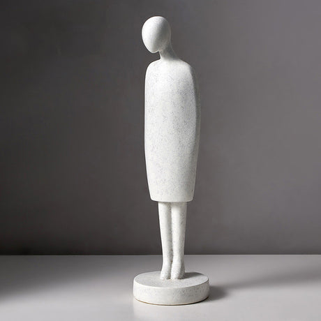 Abstract marble sculpture of a standing figure on a gray background