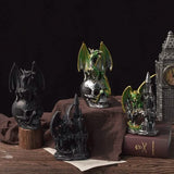 Collection of decorative figurines including a dragon, castle, and clock tower on a dark background.