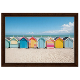 “Coastal Candy Huts” | Wall Art Print - Framed Canvas - 30x45 cm / 12x18″ - Dark wood frame
