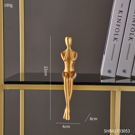 Golden Abstract Resin Sculptures – Modern Sitting Figures (Holding Flowers, Shy Pose, Hugging Couple) - Shy - 