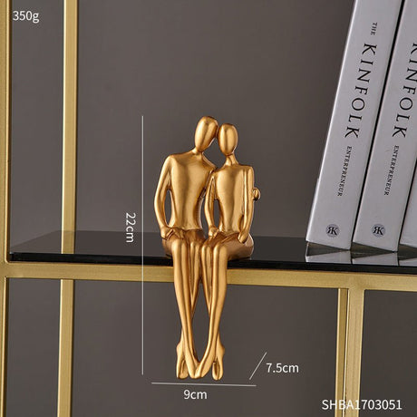 Golden Abstract Resin Sculptures – Modern Sitting Figures (Holding Flowers, Shy Pose, Hugging Couple) - Hugging - 